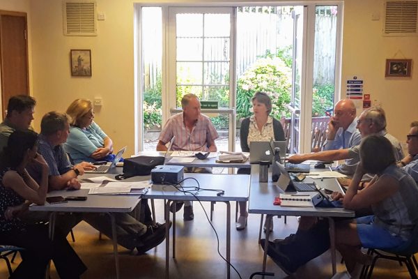 Image of the council at a council meeting